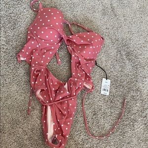 Brand new one piece with center cut out